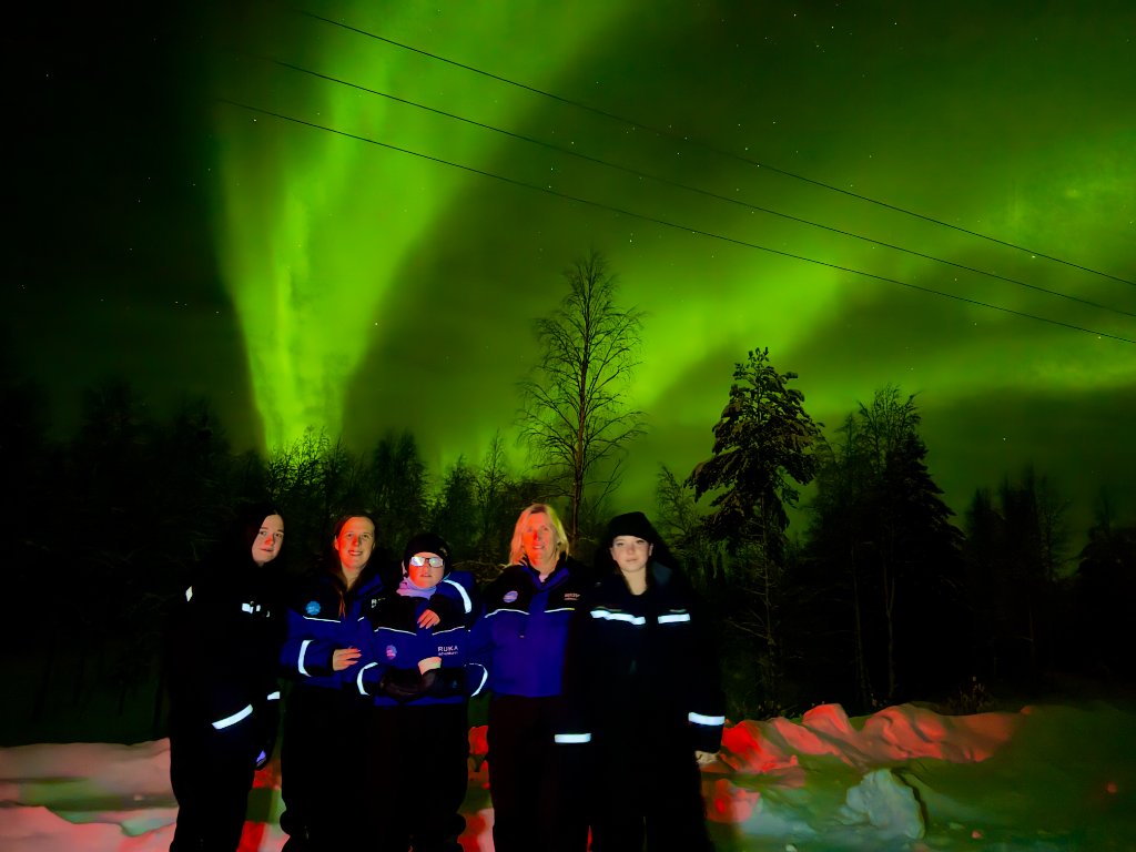 Glass igloo night under the northern lights